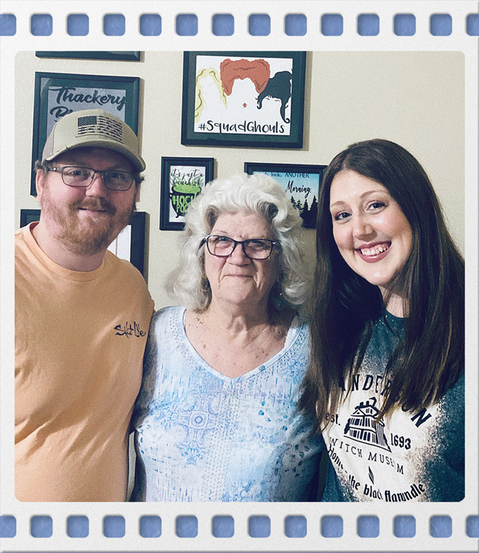 Janice Hart posing with Ashley Hart & another family member